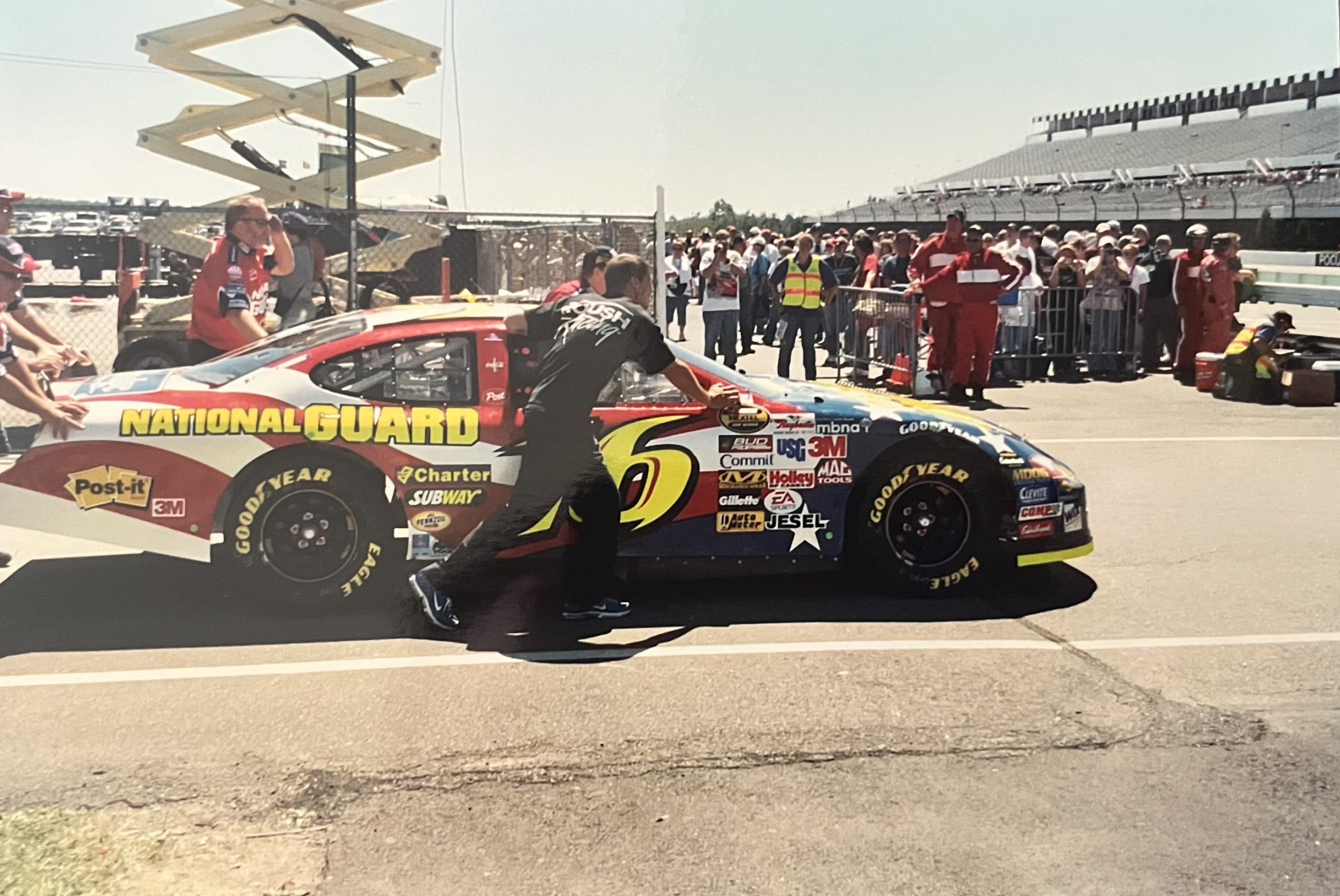 Greg Biffle's car being pushed in the garage at Pocono in 2005